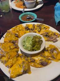 The Cove signature dishes Bean and Cheese Nachos
Fish Tacos
Lisa Special